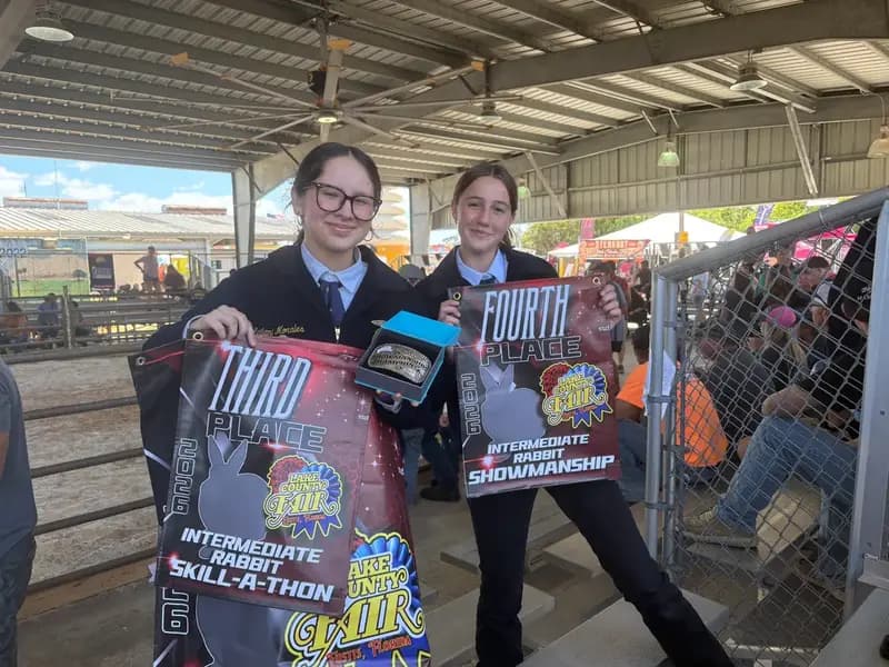 Two students holding awards at the Lake County youth fair